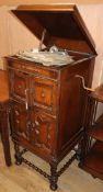 A 1920's oak cabinet, wind-up gramophone and 78 rpm records gramophone W.58cm