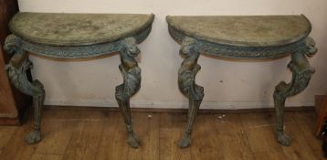 A pair of 18th century style faux verdigris demi lune console tables W.90cm