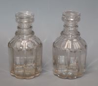 A pair of George IV pillar cut glass decanters, with lenticular effect height 22cm (no stoppers)