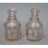 A pair of George IV pillar cut glass decanters, with lenticular effect height 22cm (no stoppers)