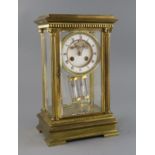 An early 20th century French ormolu four glass mantel clock, with enamelled Roman dial, visible