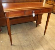 An early 19th century rectangular mahogany folding tea table W.91cm