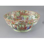 A large Chinese Canton-decorated famille rose punch bowl, c.1830, the interior and exterior