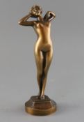 Leon-Louis Oury (1867-1940). A bronze figure of a stretching female nude, signed and inscribed