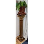 A carved giltwood Corinthian column pedestal, H.111cm, surmounted by a toleware planter