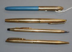 Two gold Waterman pens and two others