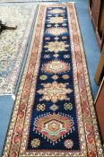 A Caucasian design blue ground runner 350 x 90cm