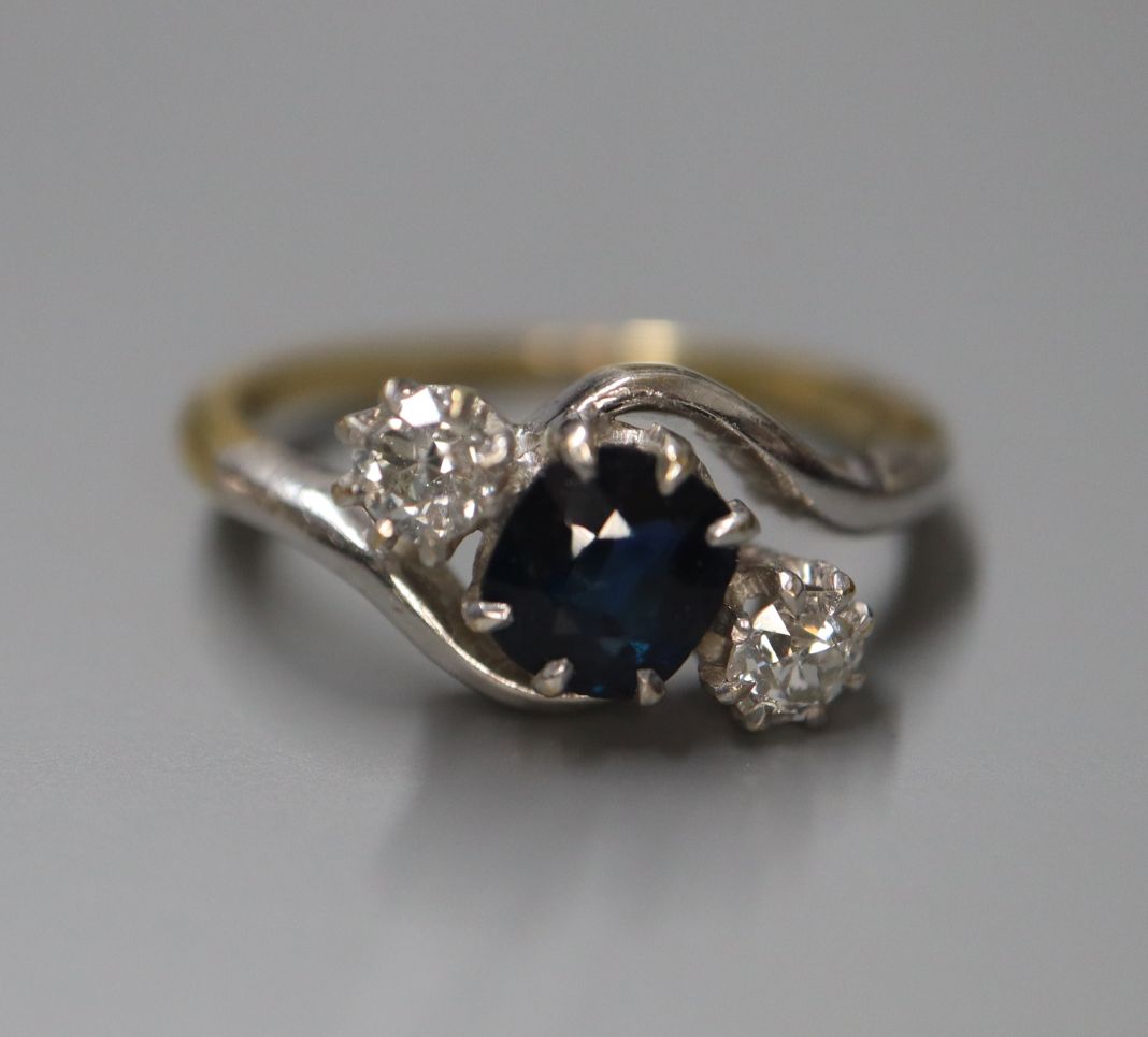 An 18ct, sapphire and diamond three stone crossover ring, size K. - Image 2 of 2