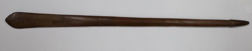 A Polynesian hardwood paddle club, probably 19th century, with single carved rib decoration, 46.