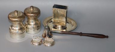 A George V silver matchbox holder stand, a pair of modern silver mounted salt and pepper mills, pair