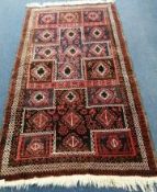 A Belouch rug 205 x 109cm