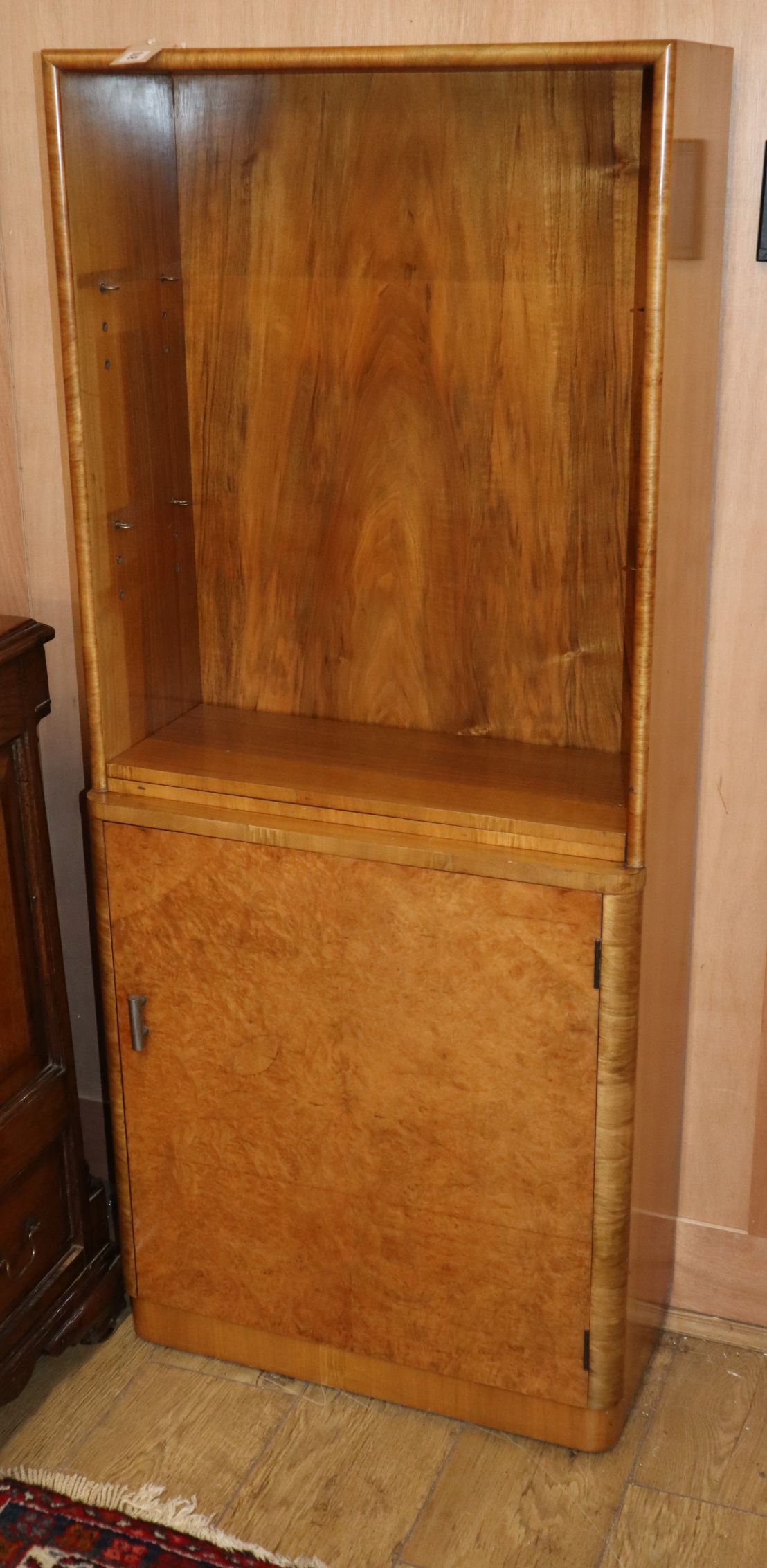 An Art Deco figured walnut bookcase W.61cm