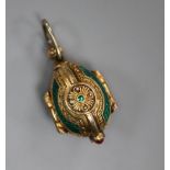 A gilt white metal and enamel egg shaped triptych charm, opening to reveal The Holy Trinity?, 27mm.