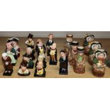 A group of nineteen Royal Doulton figures and toby jugs, eighteen Dickens characters