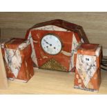 A French Art Deco rouge marble clock garniture