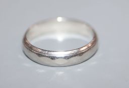 A white metal band stamped 'platinum', size K/L.