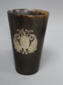 A 19th century Scottish? horn beaker with white metal twin dolphin applique, 10.1cm.