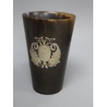 A 19th century Scottish? horn beaker with white metal twin dolphin applique, 10.1cm.