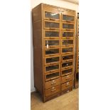 An early 20th century 'Dudley & Co.' twenty drawer shop cabinet W.85cm