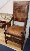 A 17th century style oak elbow chair