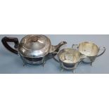 A George V silver three piece tea set, Birmingham, 1934, gross 29.5 oz.