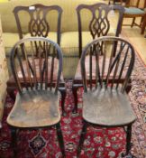 A pair of George III style dining chairs and a pair of Windsor comb back kitchen chairs