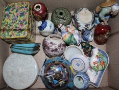 A group of Chinese and Japanese enamel wares and small porcelain items