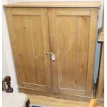 A Victorian pine two door cupboard W.107cm