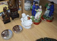 A pair of 'Departure and Return' pearlware figures, two Prattware pot lids and a porcelain cherub