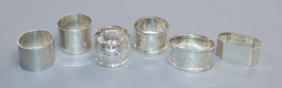 Six various Victorian and later silver serviette rings.