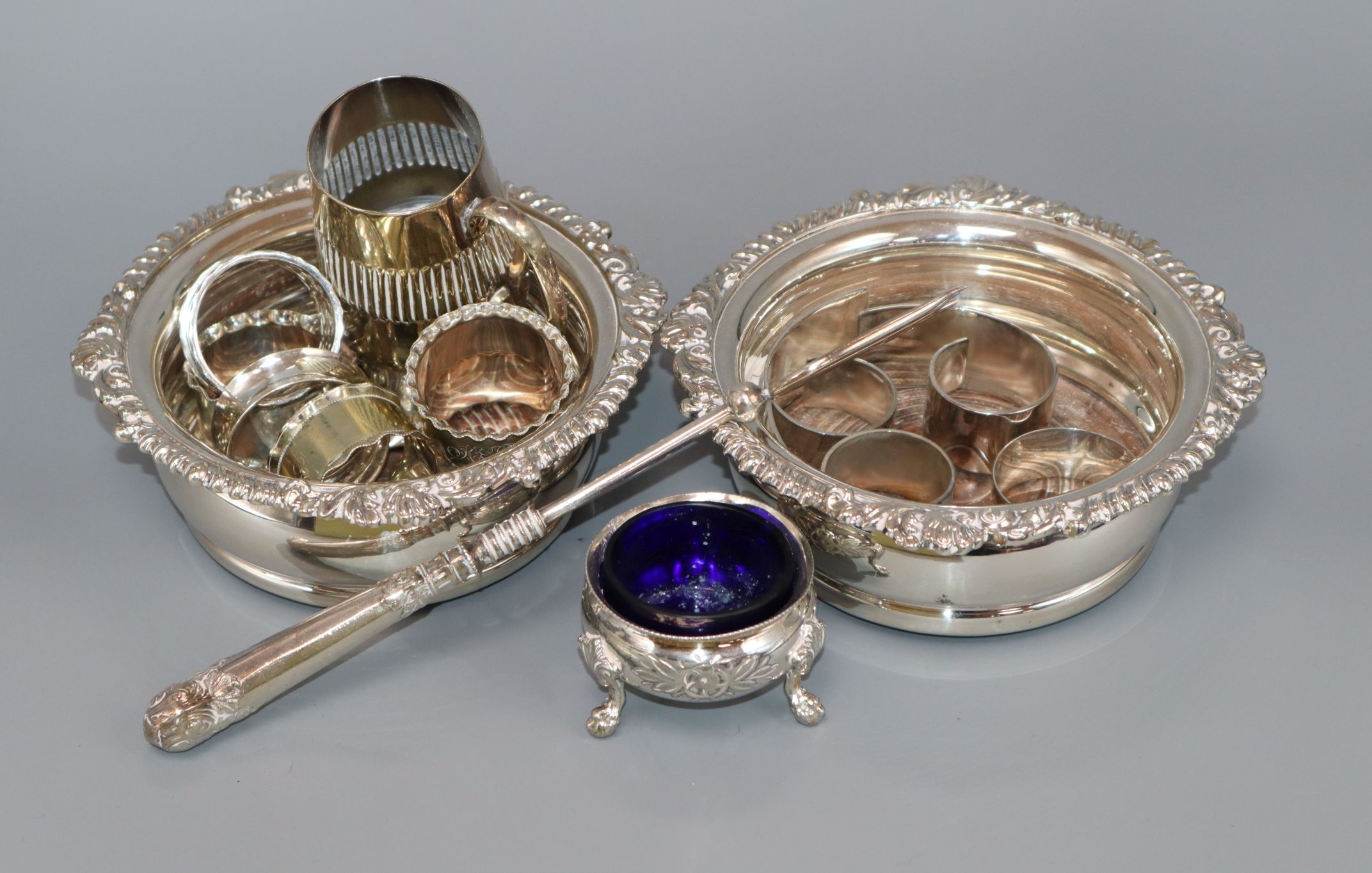 A pair of Regency style plated coasters and sundry plated wares