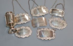 A collection of seven various silver wine and spirit labels and a George III silver pepper pot, by