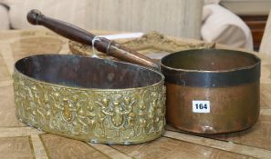 A 19th century oval embossed brass planter and an early copper pan
