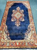 A North West Persian blue ground hall carpet 245 x 128cm