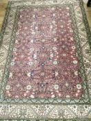 A cream ground rug 224 x 150cm