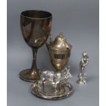 A Victorian silver goblet, a silver mustard pot, two Middle Eastern dishes, a model cow and a