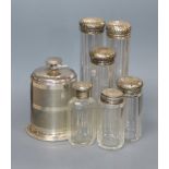 A George V engine turned silver cigarette dispenser, Birmingham, 1935 and six silver lidded glass