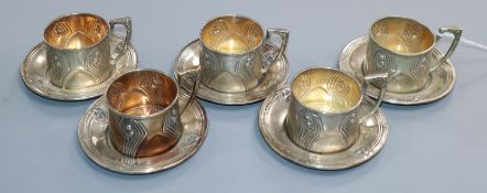 A set of five Vienna Art Nouveau 800 standard white metal coffee cups and saucers, maker, KJ.