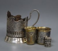 A 19th century Russian gilt 84 zolotnik tot, a later beaker, a Moscow Olympics 1980 Podstakannik and