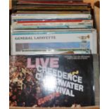 A collection of Lps and 45s including Credence Clearwater Revival, Jonny Cash, Elton John etc.