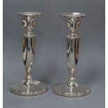 A pair of moder silver candlesticks, on circular bases weighted, 17cm.