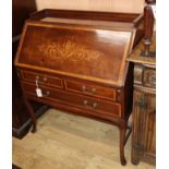 An Edwards and Roberts marquetry inlaid mahogany bureau W.89cm