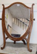 An Edwardian mahogany shield-shaped toilet mirror H.76cm