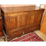 An 18th century oak and mahogany panelled mule chest W.132cm