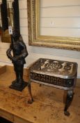 A 19th century steel footman, W.40cm, together with a cast iron companion stand W.40cm