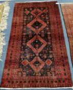 A Baluchi carpet 174 x 95cm