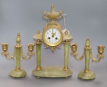 An early 20th century ormolu mounted green onyx clock garniture, the clock signed Galier Rouen clock