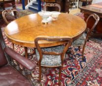 A Victorian oval figured walnut loo table together with a set of four Victorian mahogany balloon