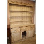 A Victorian pine dresser, with boarded rack W.163cm