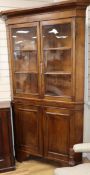 An early 19th century mahogany banded oak standing corner cupboard W.106cm